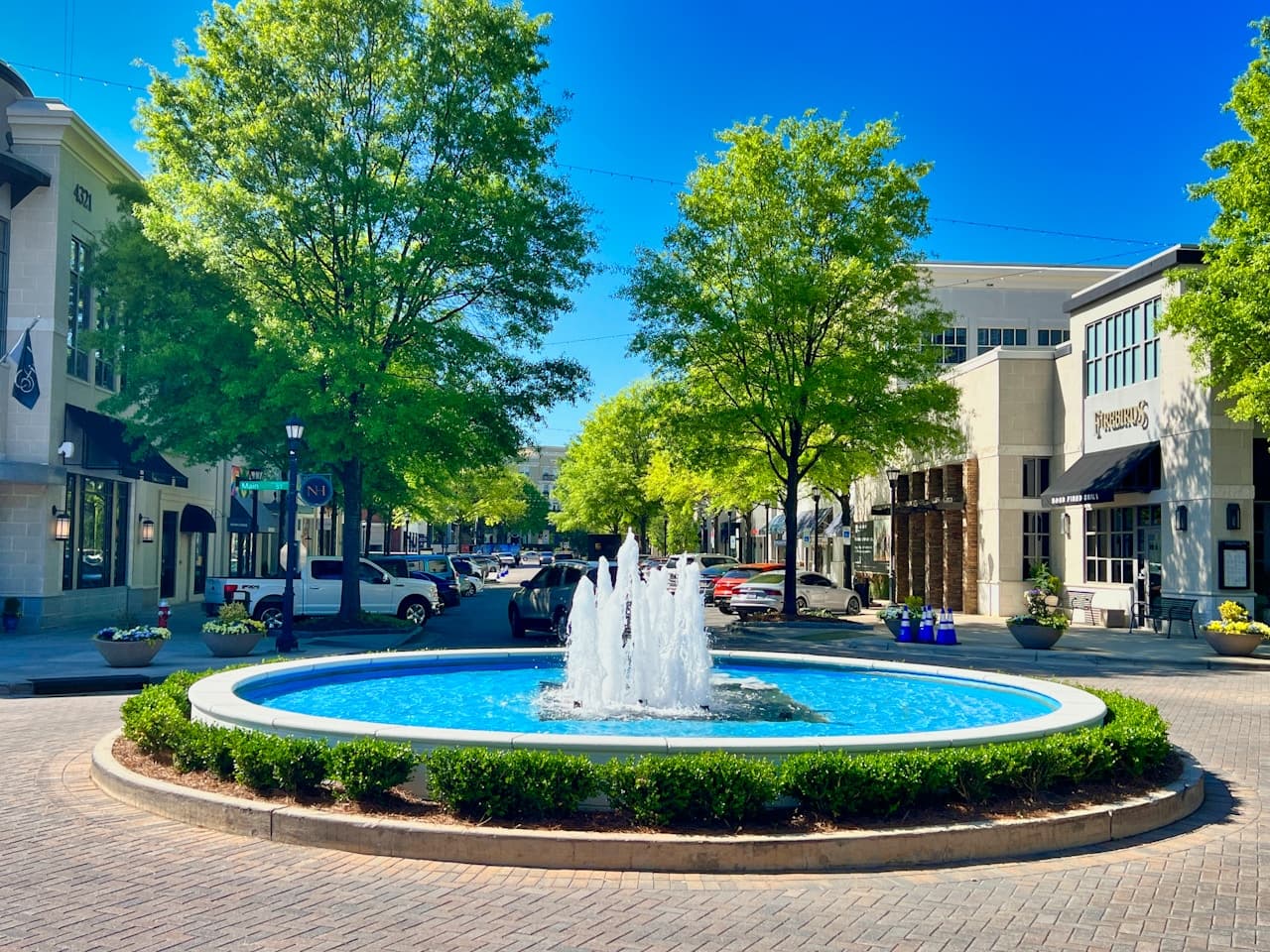 Upscale outdoor lifestyle center, North Carolina — fountain plaza, boutiques