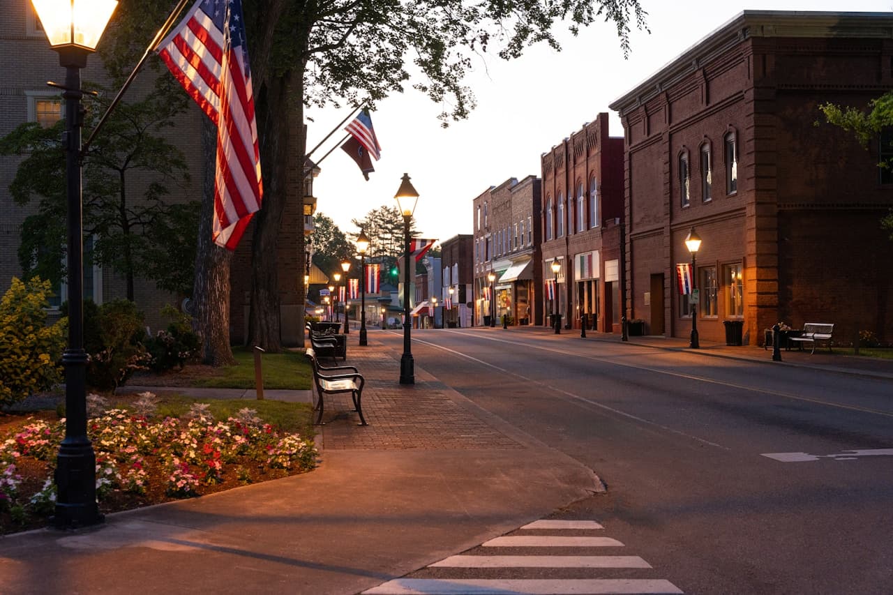 Historic Main Street, Waxhaw NC — brick storefronts and American flags